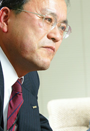 写真1：KDDIの田中孝司執行役員ソリューション事業統轄本部長
