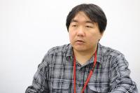 ドワンゴ 研究開発本部 戀塚昭彦氏。ニコニコ動画の最初の動画プレーヤーとメッセージ・サーバーを開発した